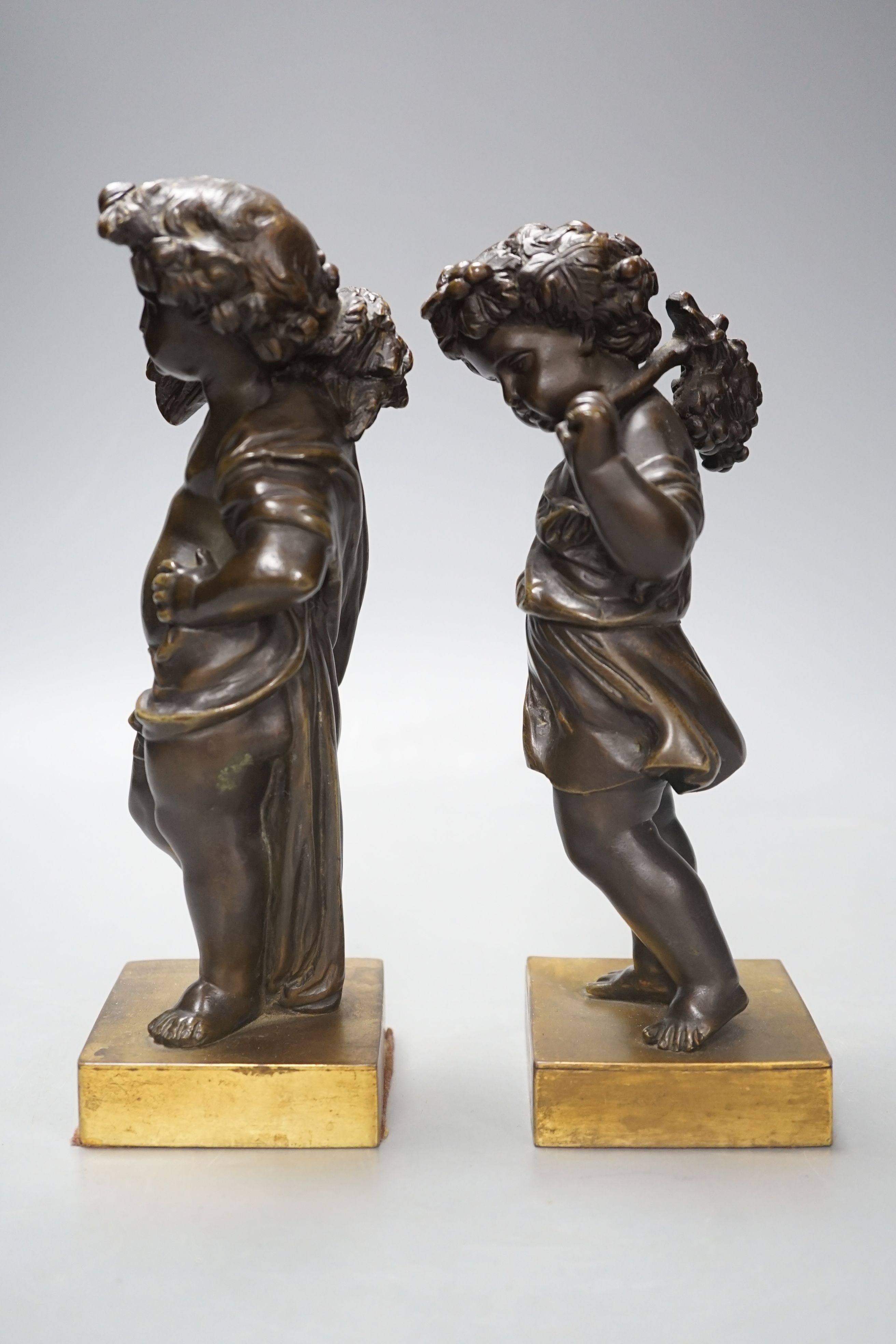 A pair of late 19th century bronze cherubs, emblematic of the seasons, Summer and Autumn, 21cm high